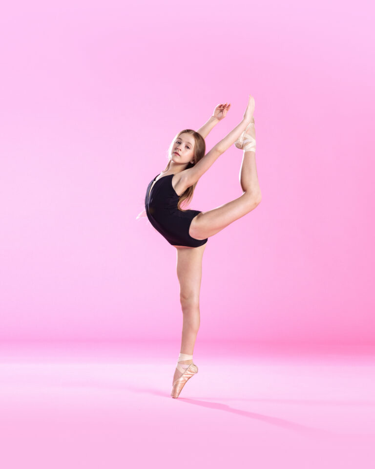 Ballet Dancer Performing Attitude En Pointe | BC Dance Tucson | Our Studio
